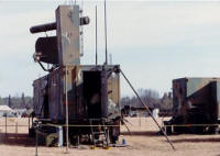 Equipment Trailer nearest in photo, Maintenance trailer inline and connected to the rear, RAPCON separate and to the right. ASR & IFF antennas toward center of trailer, PAR Elevation antenna nearest. (circa 1979-82)