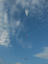Balloon and gondola in flight