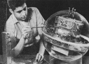 The designer of the satellite is shown at making an adjustment in an equatorial thermistor sensor - RF Cafe