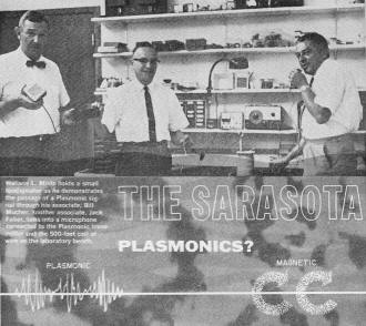 Wallace L. Minto holds a small loudspeaker as he demonstrates the passage of a Plasmonic signal - RF Cafe