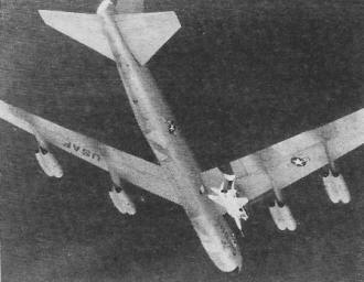 Test vehicle hangs below the big wing of a B-52 - RF Cafe