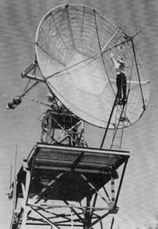 Paul Wilson, W4HHK, at work on the 18-foot dish - RF Cafe