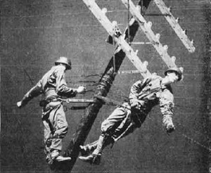 Signal Corps communications is shown as Corpsmen adjust military telephone wires - RF Cafe