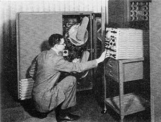 Customer engineer, working for IBM, checks out a pair of magnetic drums - RF Cafe
