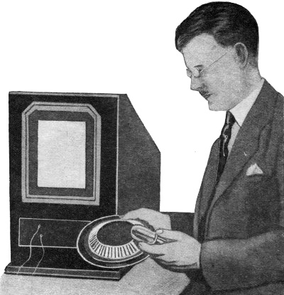 Arthur H. Watson holding the new scanning disc - RF Cafe