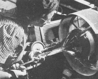 Operator is shown installing the cathode-ray gun - RF Cafe