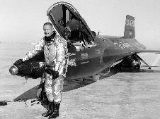 Neil Armstrong standing in front of X-15 on lakebed Neil Armstrong standing in front of X-15 on lakebed