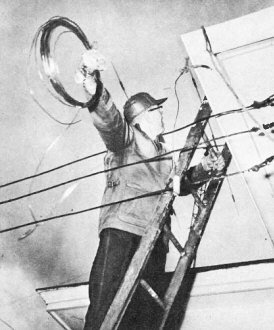 Obviously this OM is trying to string a long wire antenna - RF Cafe