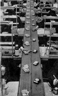 Pocket transistor radios are being mass produced on assembly lines - RF Cafe