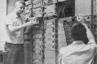Brian Marshall and John Sheridan installing new transistorized frequency stacking multiplex system - RF Cafe