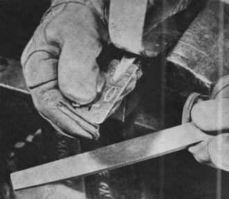 Lineman's life depends on his climbing irons - RF Cafe