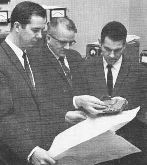 The repair team: John S. Mayo, left, holds the circuit diagram of the command decoder - RF Cafe